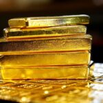 Gold prices nurse tumble from record highs with Powell, rate cuts in focus