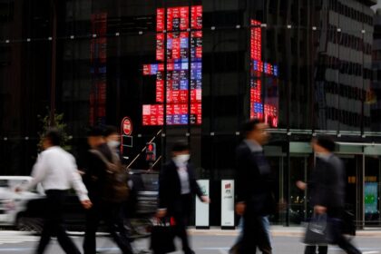 Japan keeps economic recovery view, flags US policy risks