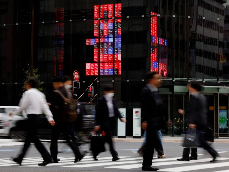 Japan keeps economic recovery view, flags US policy risks