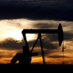 Oil falls on demand growth concerns, robust dollar